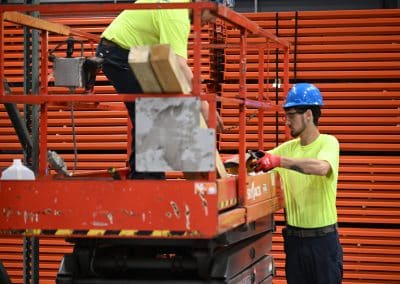 Employees working on and around a Skyjack scissor lift